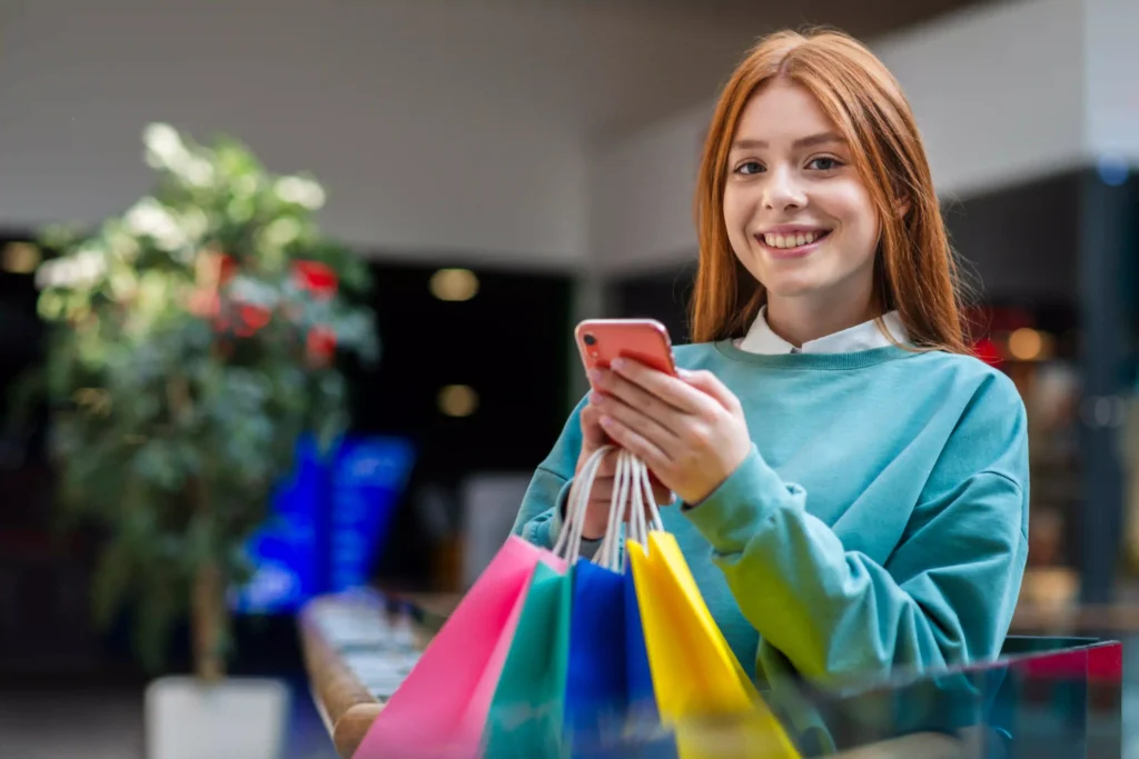 smiling women buying product from shopify store
